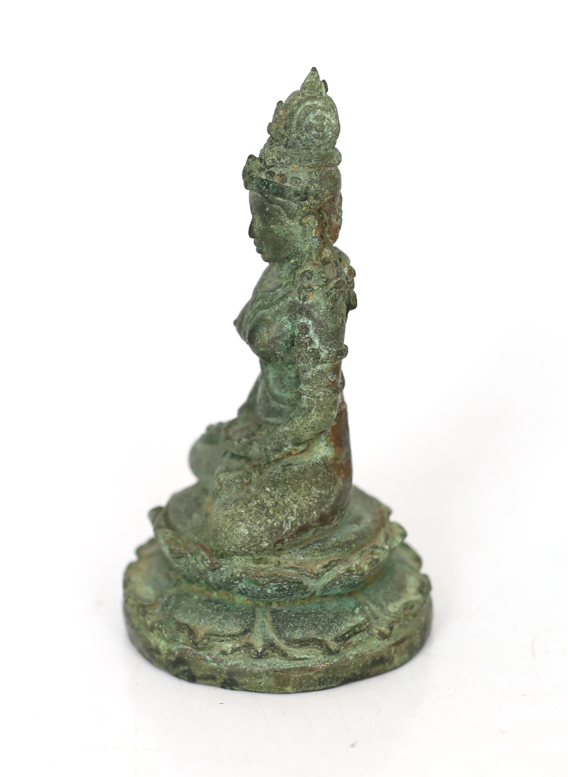 A bronze seated figure of Tara, Central Java, 9th century